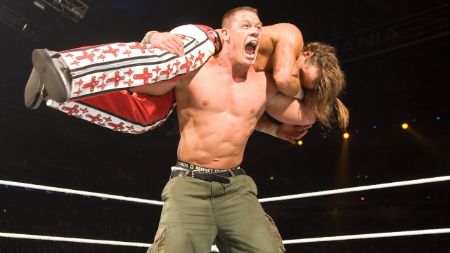 John Cena doing his finishing move during a match.